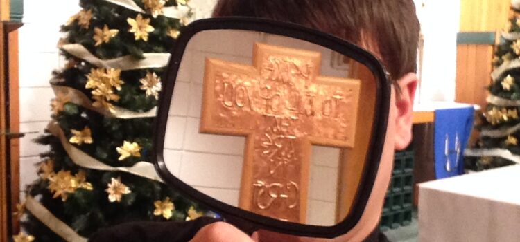 The preacher with a mirror reflecting the cross